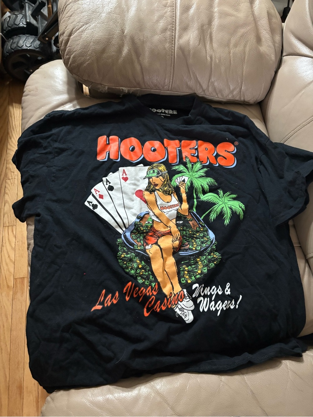 Hooters Black Tee with Orange Logo and Multicolor Casino Graphic
